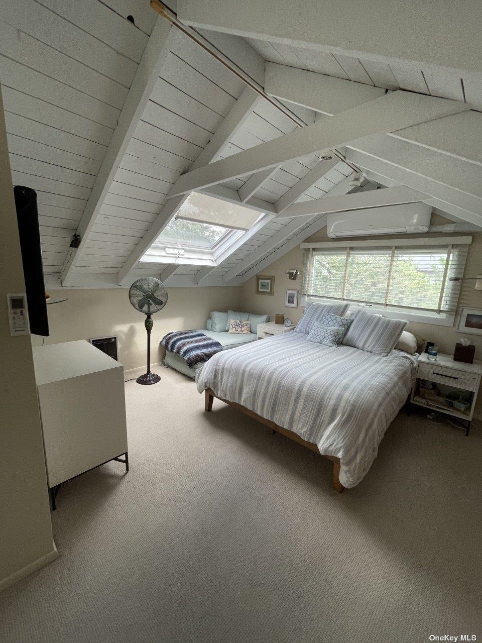 275 Wilmot Road Ocean Beach, NY 11770 - Photo 7 of 19 a bedroom with bed and window