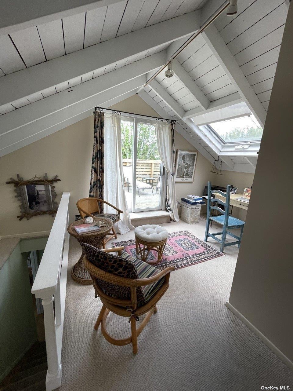 275 Wilmot Road Ocean Beach, NY 11770 - Photo 9 of 19 a living room with furniture and a large window