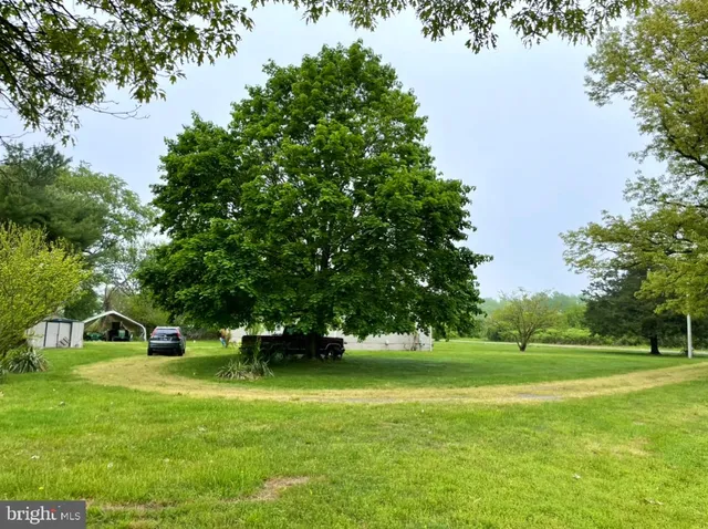 a view of a house with a big yard