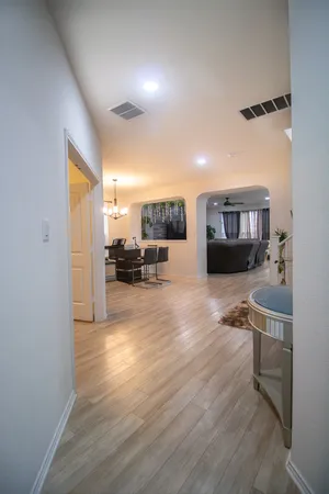a view of living room with furniture and a potted plant