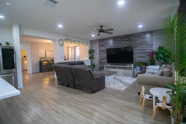 a living room with furniture and a flat screen tv