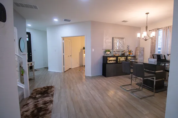 a kitchen with stainless steel appliances kitchen island granite countertop a refrigerator and a stove top oven