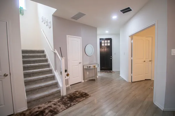 a view of entryway with wooden floor