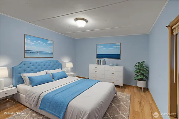 a bedroom with a bed and a painting on the wall