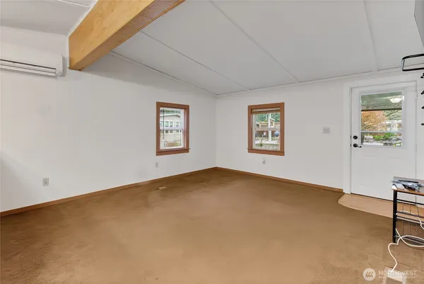 a view of an empty room with a window