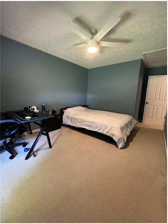 275 Summerfield Crossing Acworth, GA 30101 - Photo 16 of 30 a bedroom with a bed and a ceiling fan