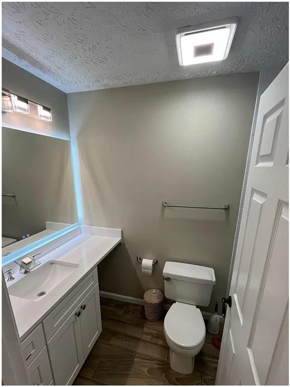 275 Summerfield Crossing Acworth, GA 30101 - Photo 18 of 30 a bathroom with a toilet sink and mirror