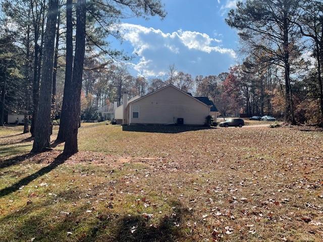 275 Summerfield Crossing Acworth, GA 30101 - Photo 23 of 30 a view of a wooden house with a yard