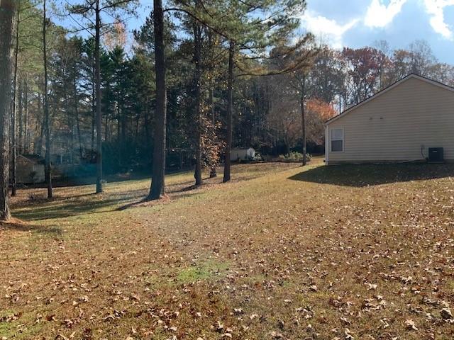 275 Summerfield Crossing Acworth, GA 30101 - Photo 24 of 30 a backyard of a house with lots of green space