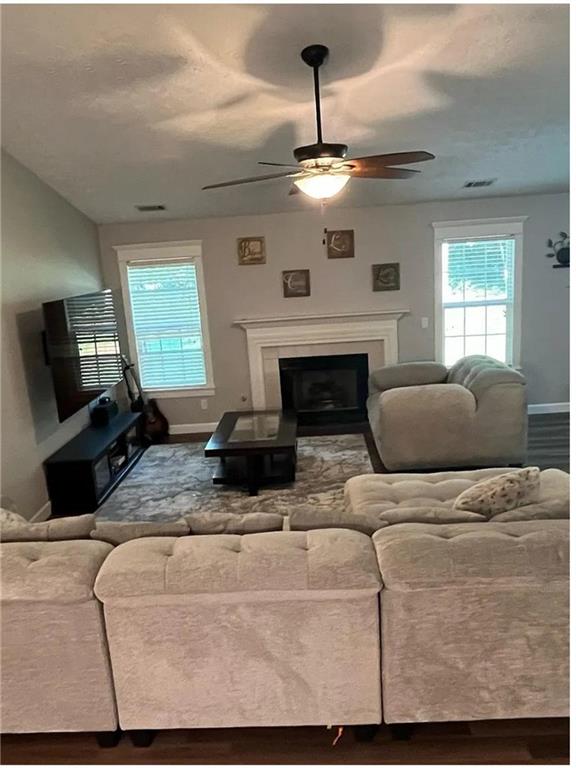 275 Summerfield Crossing Acworth, GA 30101 - Photo 8 of 30 a living room with furniture and a fireplace