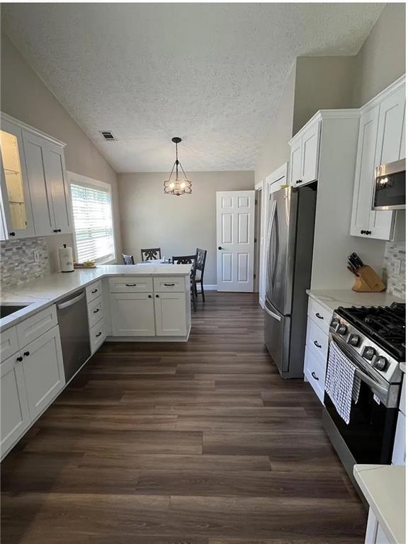 275 Summerfield Crossing Acworth, GA 30101 - Photo 10 of 30 a kitchen with stainless steel appliances a refrigerator sink and cabinets