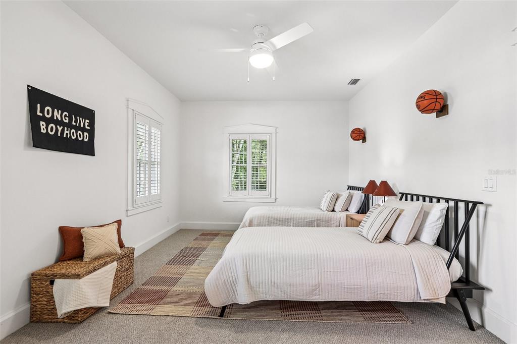 1012 Morfield Lane Brandon, FL 33511 - Photo 68 of 100 a bedroom with a bed and a couch