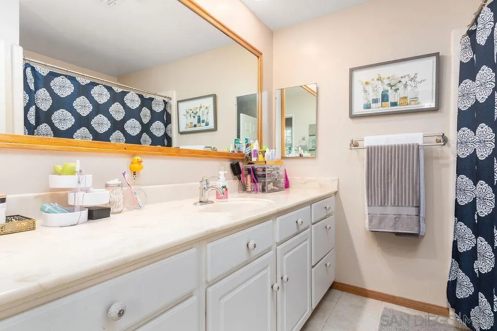 10750 Anaheim Drive La Mesa, CA 91941 - Photo 15 of 34 a bathroom with a sink and a mirror