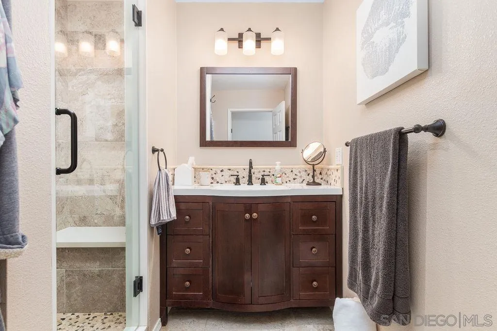 10750 Anaheim Drive La Mesa, CA 91941 - Photo 18 of 34 a bathroom with a sink double vanity and a mirror