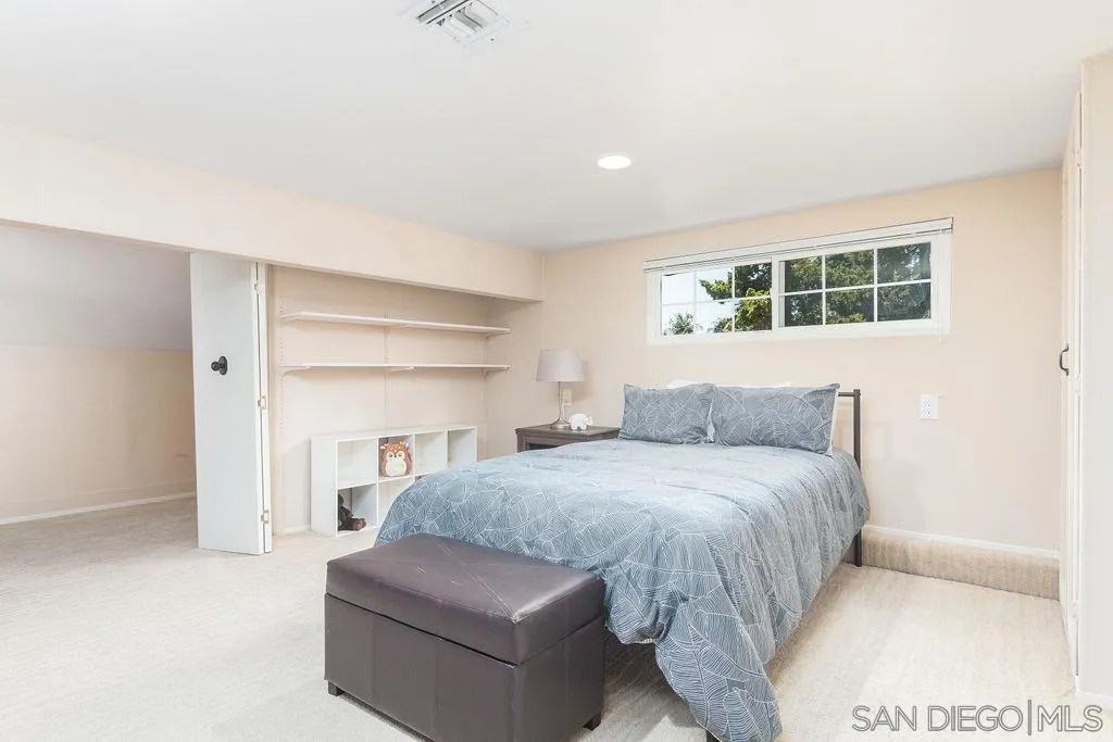 10750 Anaheim Drive La Mesa, CA 91941 - Photo 20 of 34 a bedroom with a bed and a couch