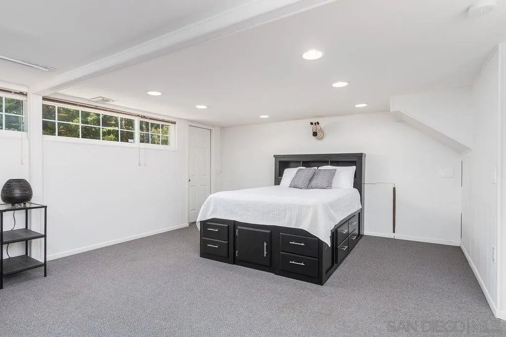 10750 Anaheim Drive La Mesa, CA 91941 - Photo 21 of 34 a spacious bedroom with a bed and a window