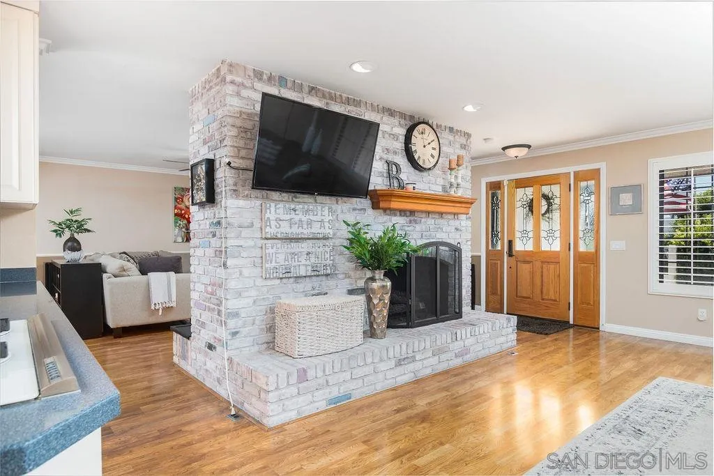 10750 Anaheim Drive La Mesa, CA 91941 - Photo 10 of 34 a living room with fireplace furniture and a flat screen tv