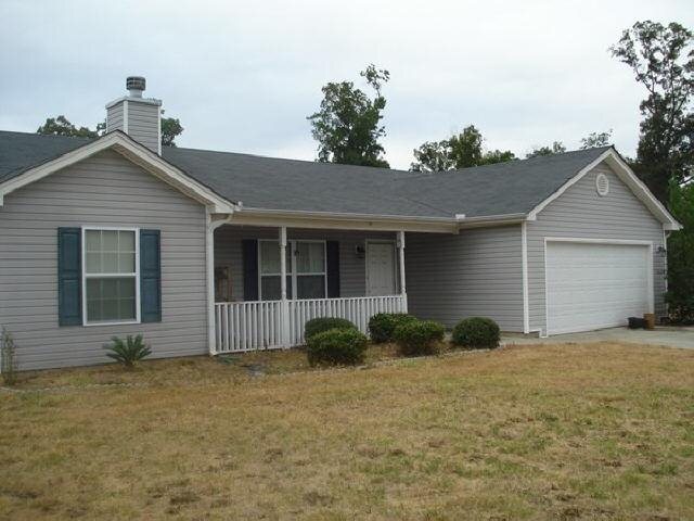 1227 Dylan Way Bethlehem, GA 30620 - Photo 1 of 1 a front view of a house with garden