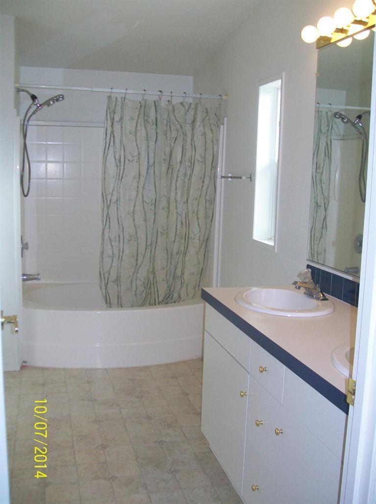 898 Greenview Road Cave Junction, OR 97523 - Photo 16 of 23 a bathroom with a granite countertop sink and a mirror