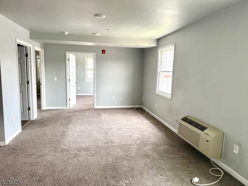 100 Sparta Avenue, Unit 21 Newton, NJ 07860 - Photo 2 of 10 an empty room with windows