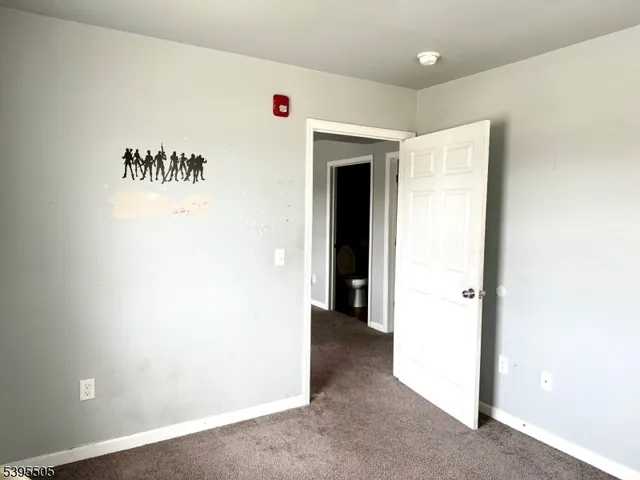 a view of a hallway with a white walls