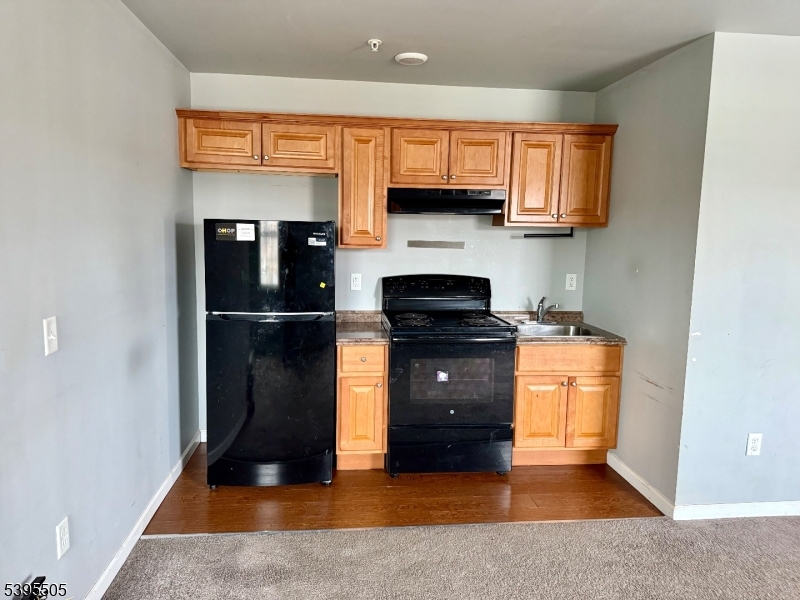 100 Sparta Avenue, Unit 21 Newton, NJ 07860 - Photo 10 of 10 a kitchen with stainless steel appliances granite countertop a refrigerator and a sink