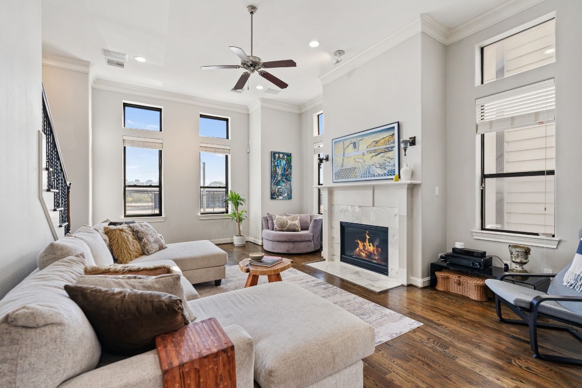1708 Dart Street Houston, TX 77007 - Photo 7 of 17 Large windows fill the high-ceiling living room with natural light.