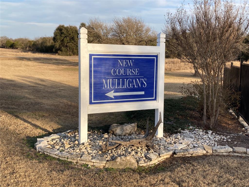 36065 Cedar Ridge Drive Whitney, TX 76692 - Photo 2 of 12 a sign on the side of the road