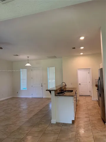 a view of a kitchen with a sink
