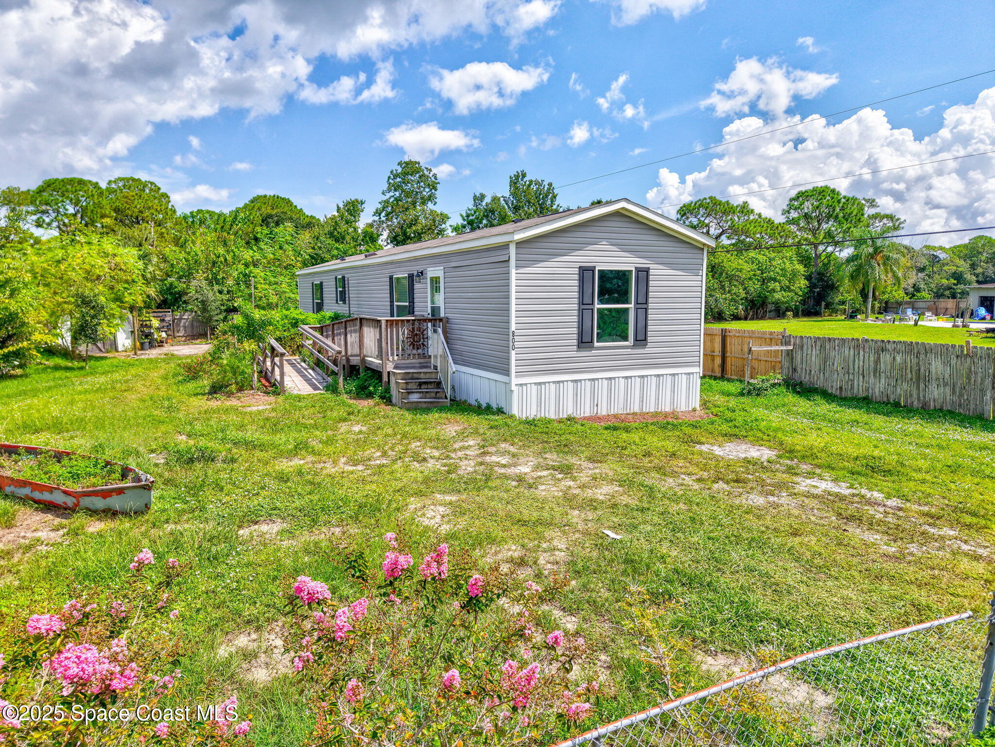 a view of backyard with garden and entertaining space
