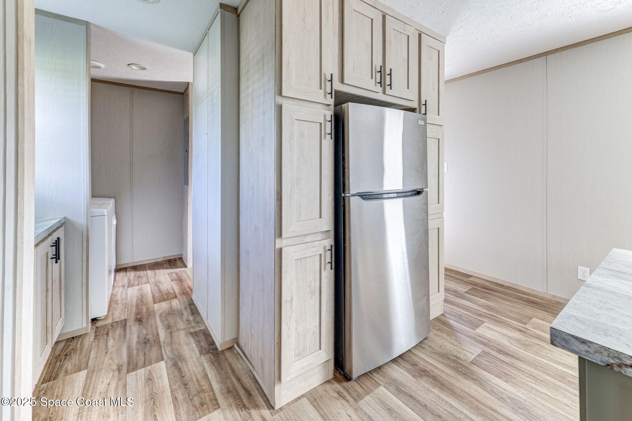 800 Phyllis Way Cocoa, FL 32926 - Photo 12 of 40 a view of a kitchen from the hallway