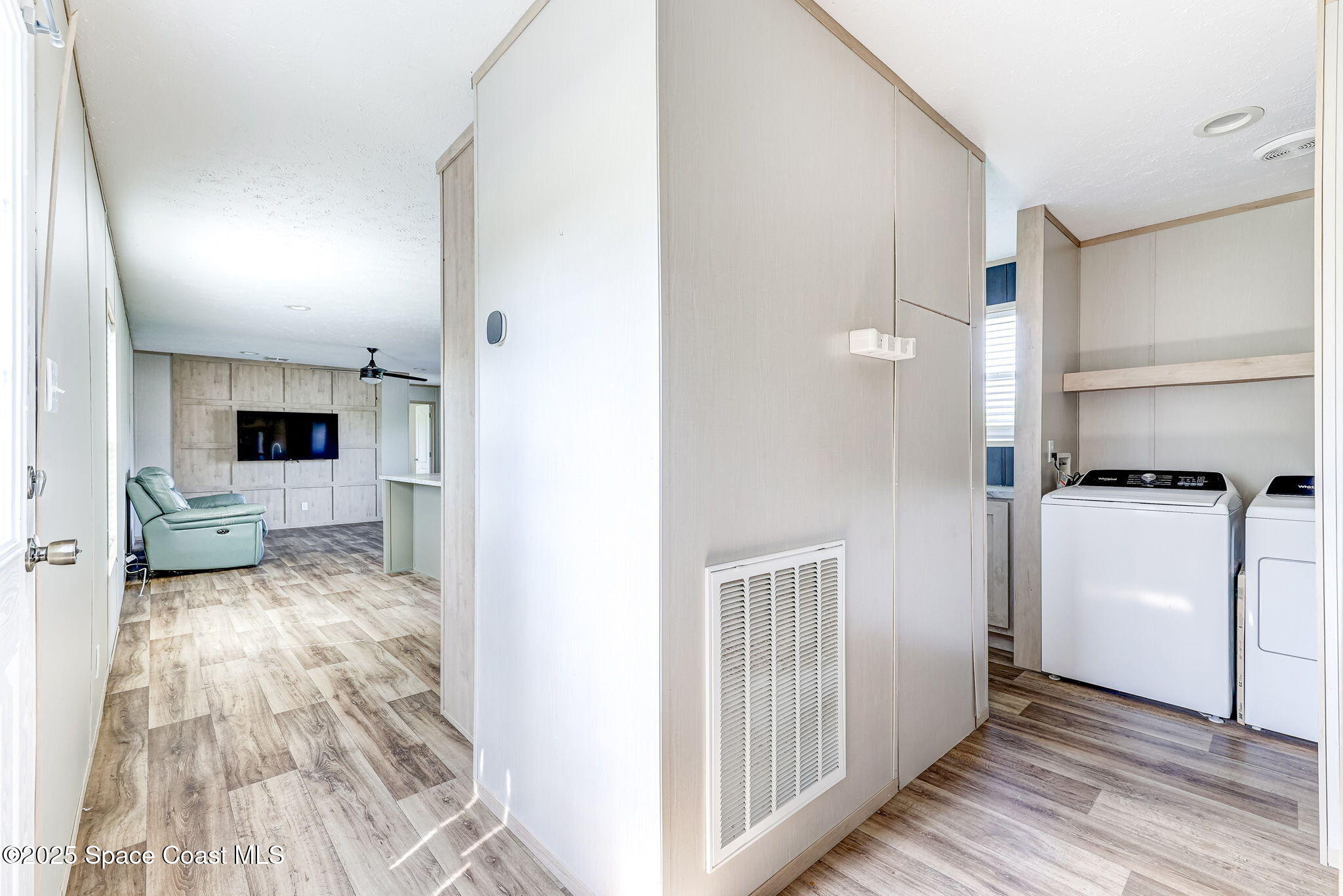 800 Phyllis Way Cocoa, FL 32926 - Photo 15 of 40 a view of a kitchen from the hallway with a white stove