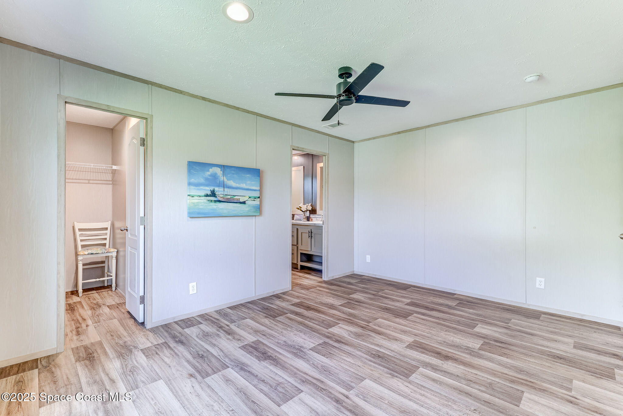 800 Phyllis Way Cocoa, FL 32926 - Photo 19 of 40 a view of empty room with wooden floor