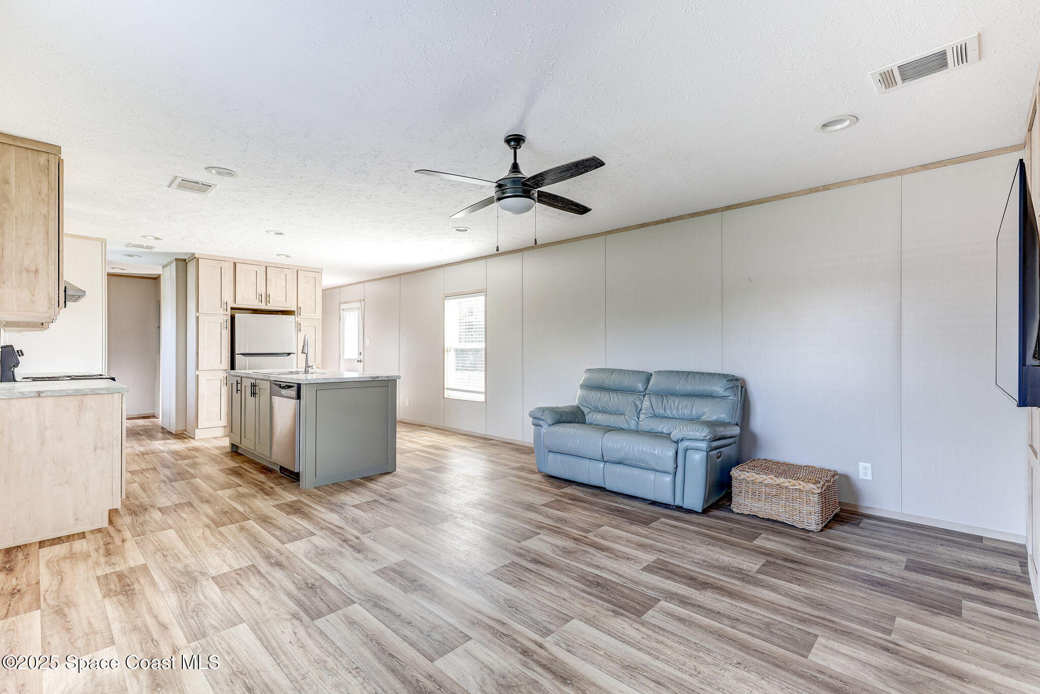 800 Phyllis Way Cocoa, FL 32926 - Photo 2 of 40 a living room with furniture and a chandelier