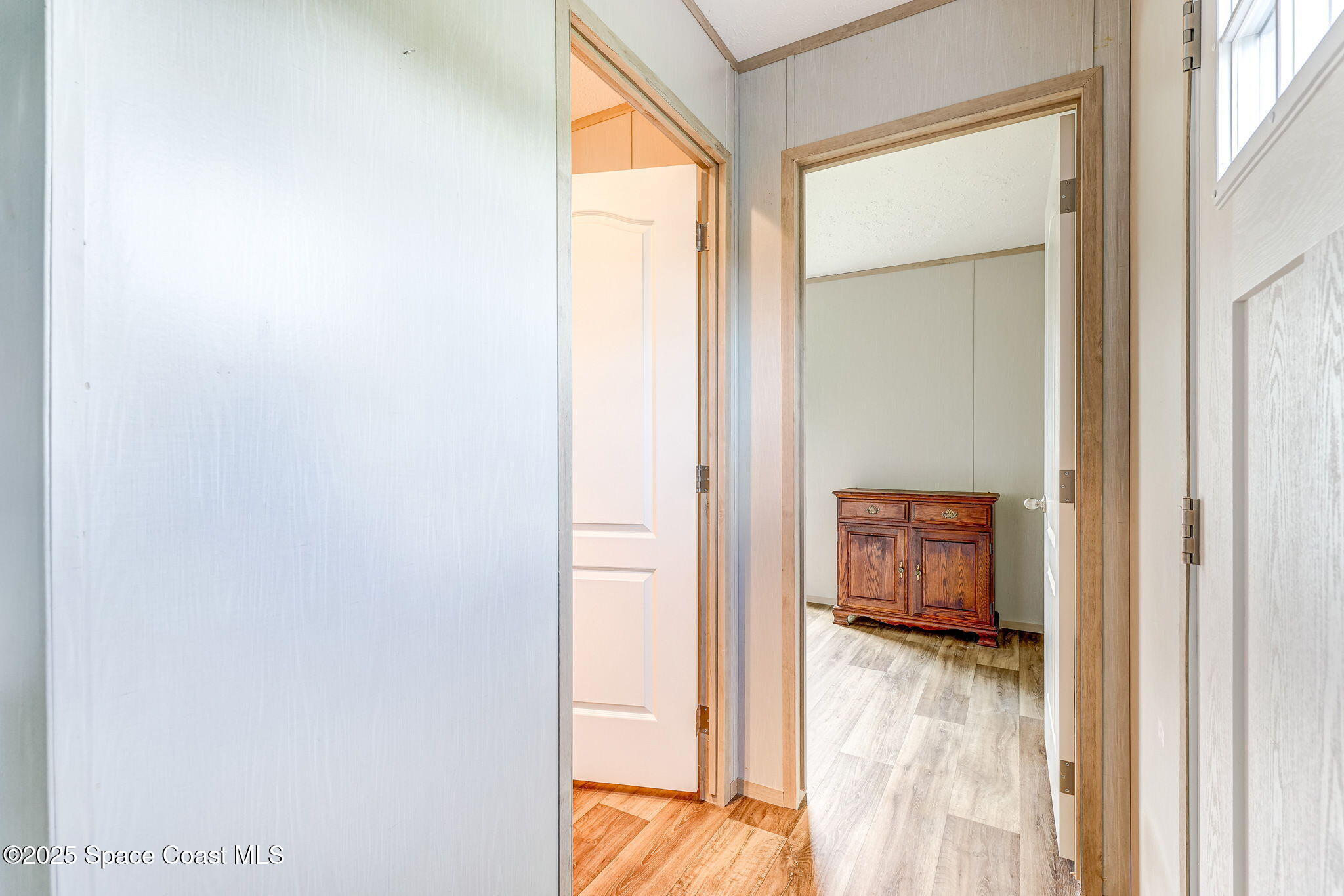 800 Phyllis Way Cocoa, FL 32926 - Photo 23 of 40 a view of a bedroom from a hallway