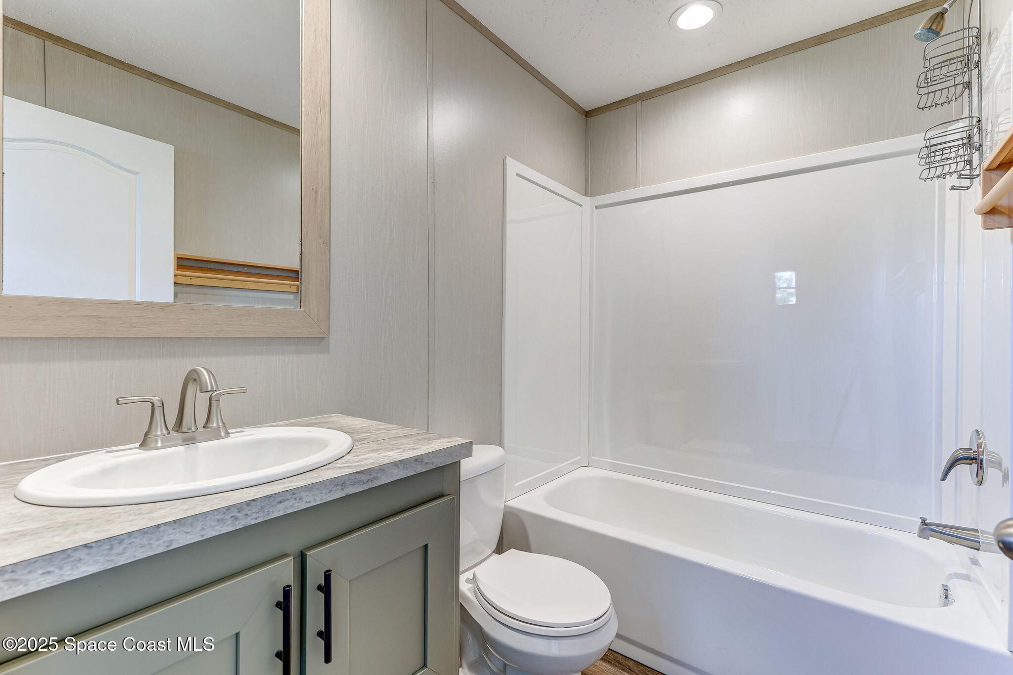 800 Phyllis Way Cocoa, FL 32926 - Photo 24 of 40 a bathroom with a granite countertop sink toilet and shower