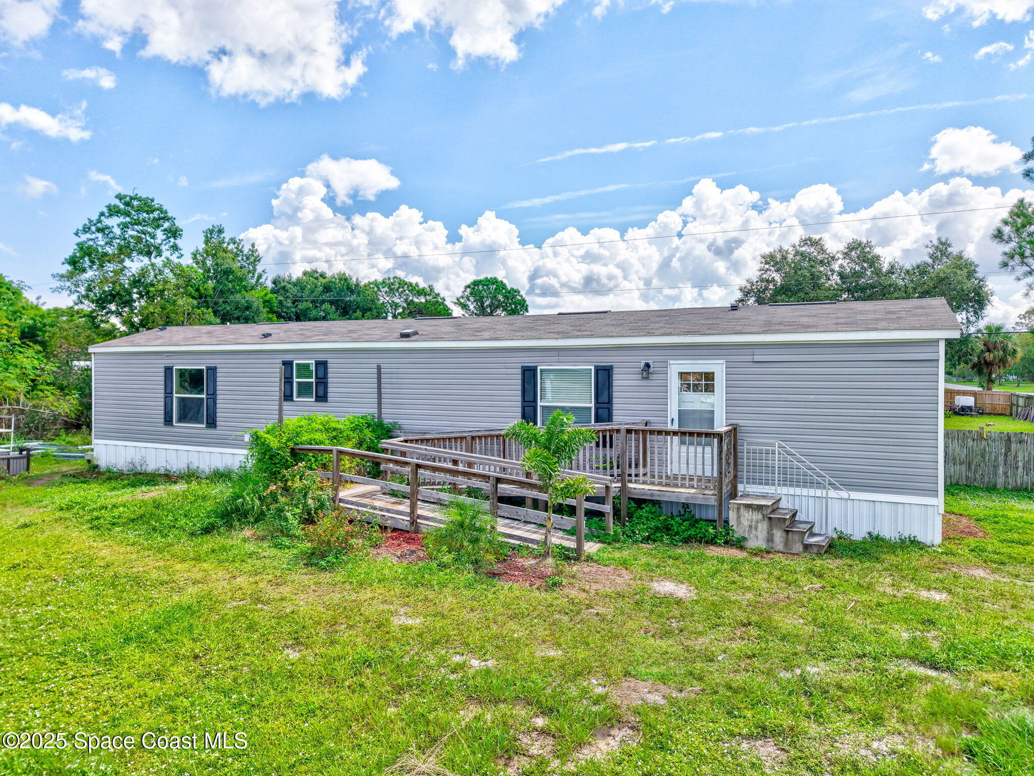800 Phyllis Way Cocoa, FL 32926 - Photo 39 of 40 front view of a house with a yard