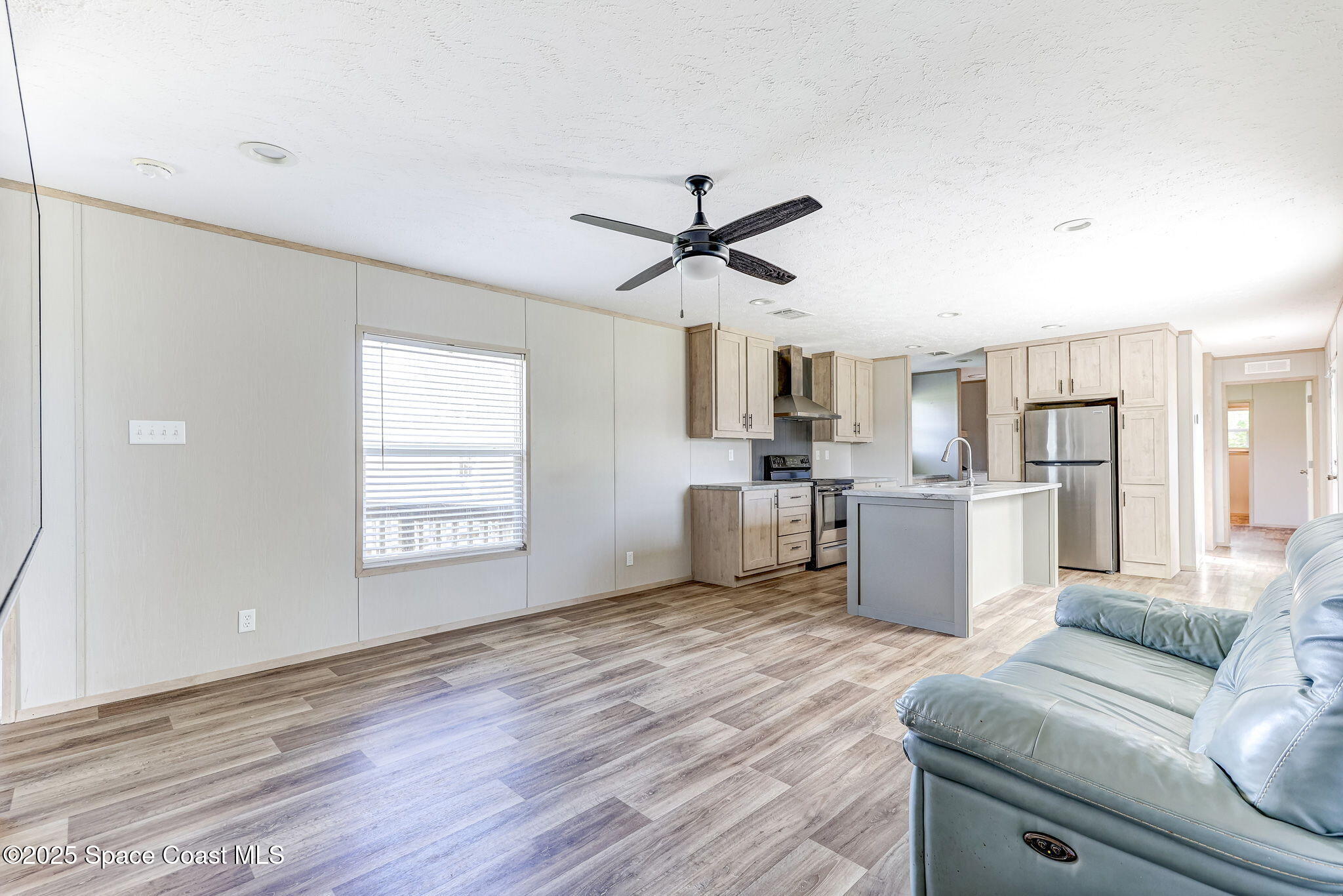 800 Phyllis Way Cocoa, FL 32926 - Photo 4 of 40 a living room with furniture and kitchen view