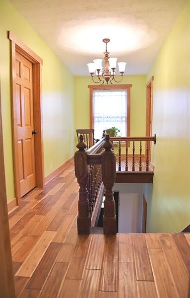 207 Mc Ewen Road Mercer, PA 16137 - Photo 13 of 23 upstairs landing has stunning hard wood flooring and open an airy feel