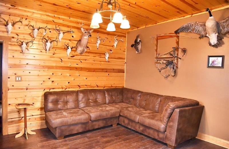 207 Mc Ewen Road Mercer, PA 16137 - Photo 6 of 23 The family room has hardwood floors and stunning wood wall and cieling