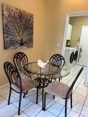 a view of a chairs and table in the kitchen
