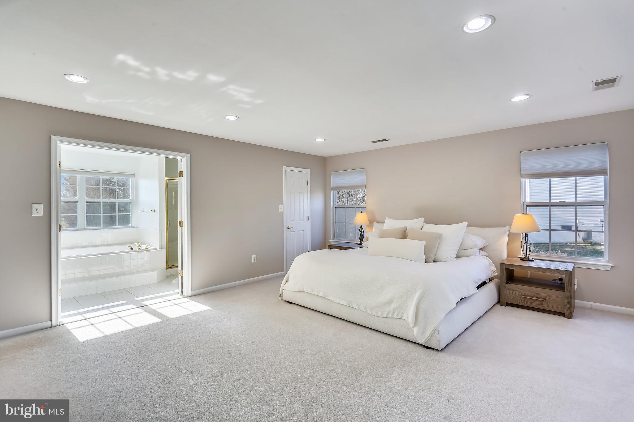 9517 Greenel Road Damascus, MD 20872 - Photo 46 of 98 a spacious bedroom with a bed and a large window