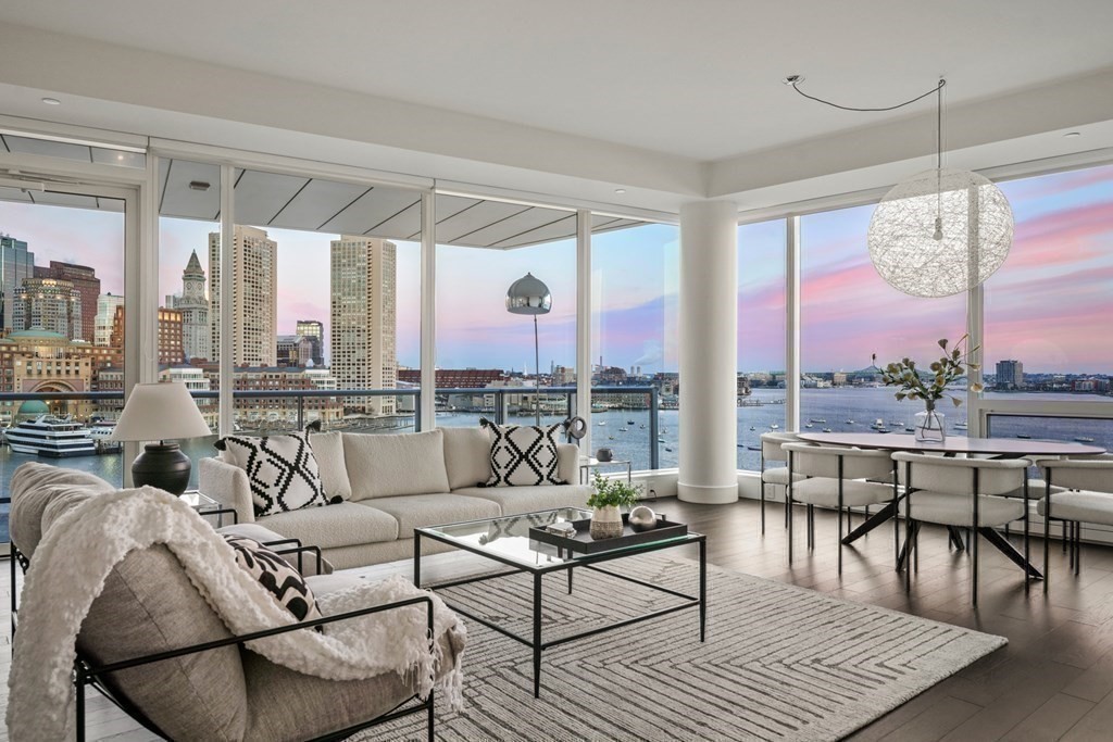 22 Liberty Drive, Unit 7A Boston, MA 02210 - Photo 11 of 31 a living room with furniture large windows and wooden floor