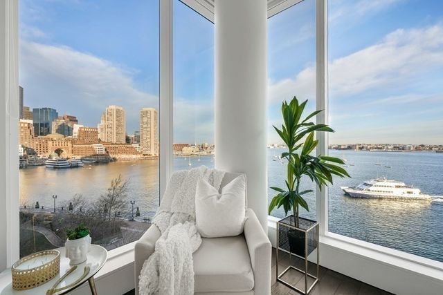 a kitchen with stainless steel appliances a sink a stove and cabinets
