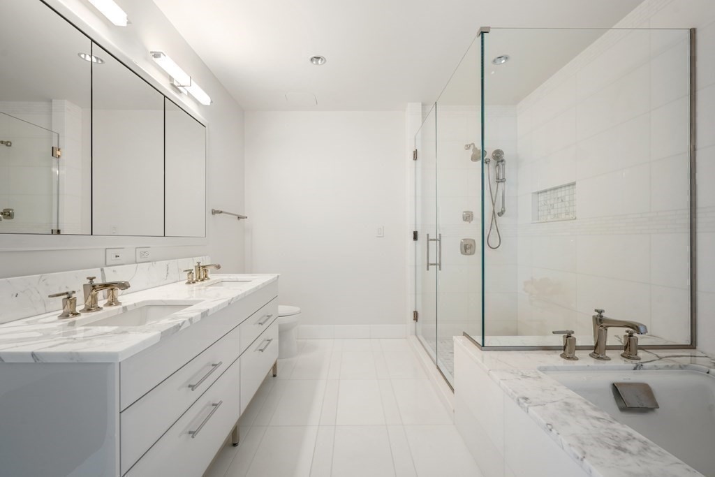 22 Liberty Drive, Unit 7A Boston, MA 02210 - Photo 17 of 31 a bathroom with a sink double vanity and a mirror