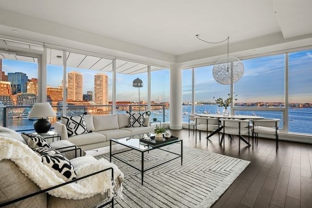 a living room with furniture and a table