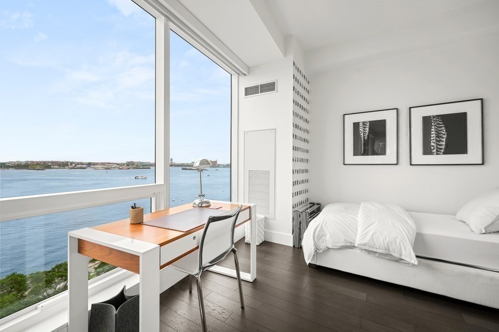 22 Liberty Drive, Unit 7A Boston, MA 02210 - Photo 26 of 31 a living room with furniture and floor to ceiling windows