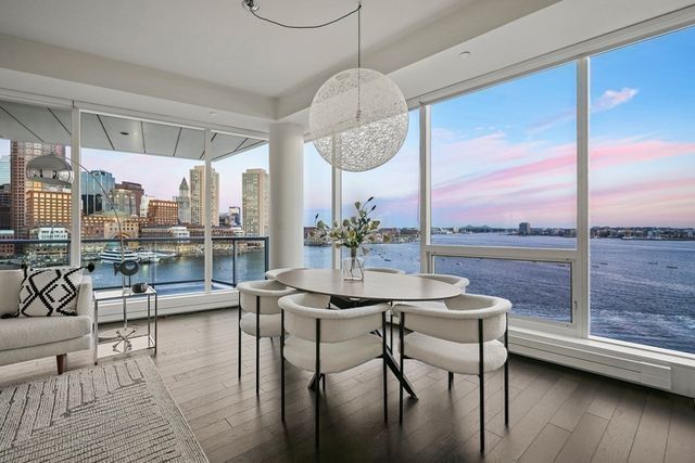 a living room with furniture wooden floor and a table