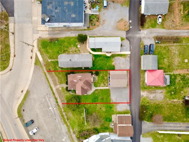 an aerial view of residential houses with outdoor space