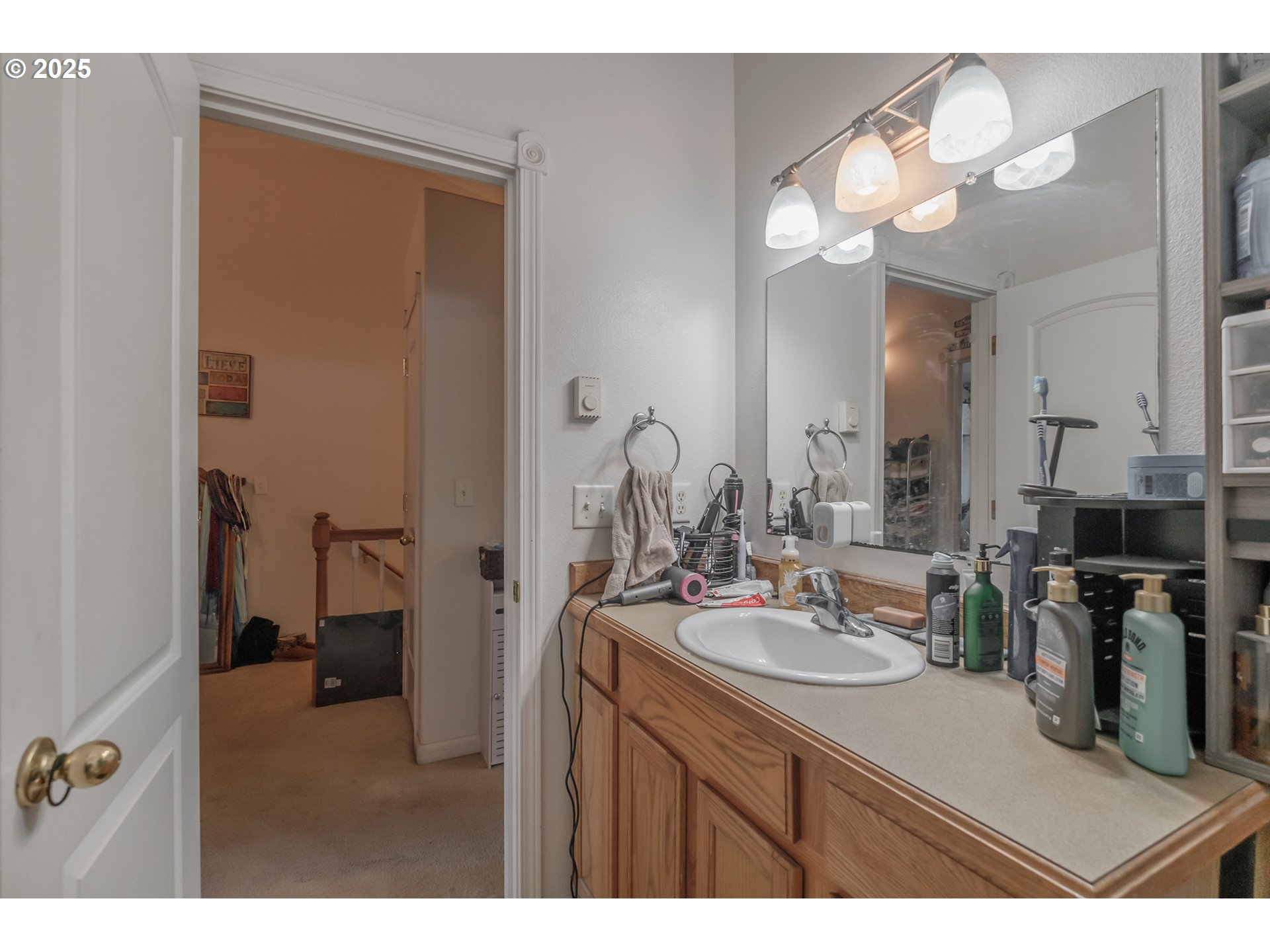 1036 9th Street Florence, OR 97439 - Photo 31 of 47 a bathroom with a sink vanity and a mirror